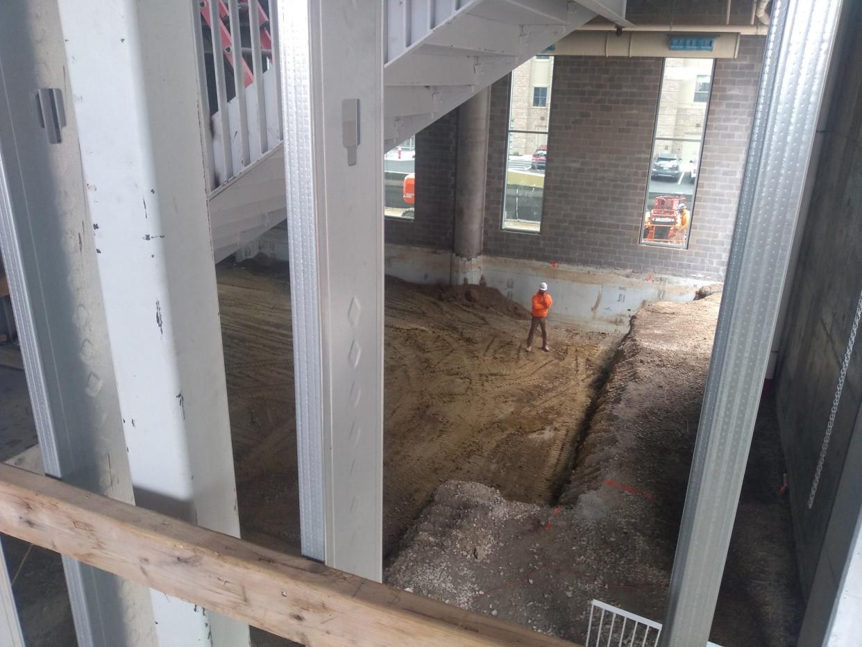 Workers dig the swimming pool Wednesday, April 10, 2024, on the first floor of the Bob Crane Community Center at Kingsdale Shopping Center in Upper Arlington.