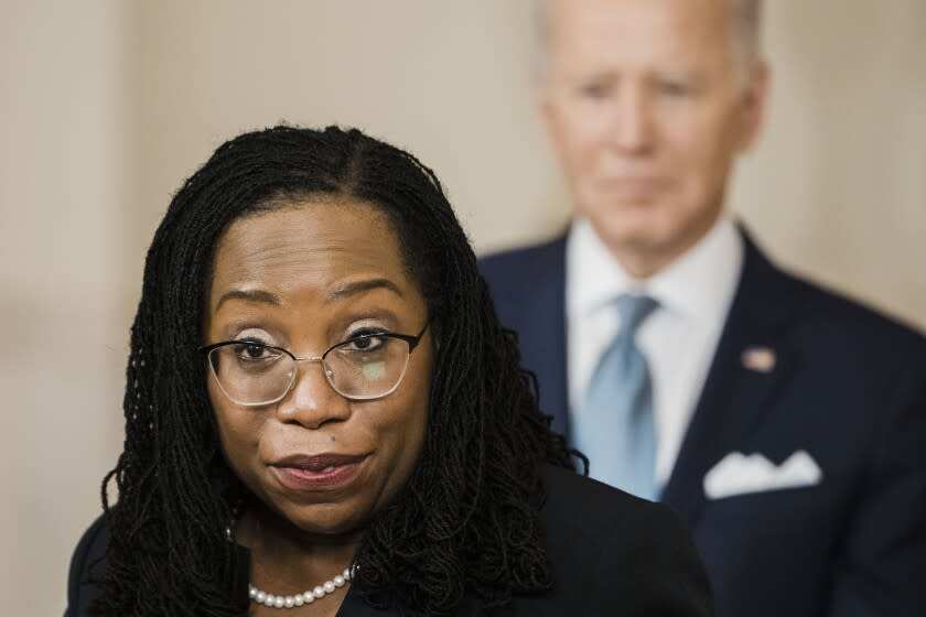 WASHINGTON, DC - FEBRUARY 25: Flanked by President Joe Biden and Vice President Kamala Harris, Judge Ketanji Brown Jackson delivers remarks on her nomination by President Biden to serve as Associate Justice of the United States Supreme Court from the Cross Hall of the White House on Friday, Feb. 25, 2022 in Washington, DC. Judge Jackson was picked by President Biden to be the first Black woman in United States history to serve on the nation's highest court to succeed Supreme Court Associate Justice Stephen Breyer who is retiring. (Kent Nishimura / Los Angeles Times)