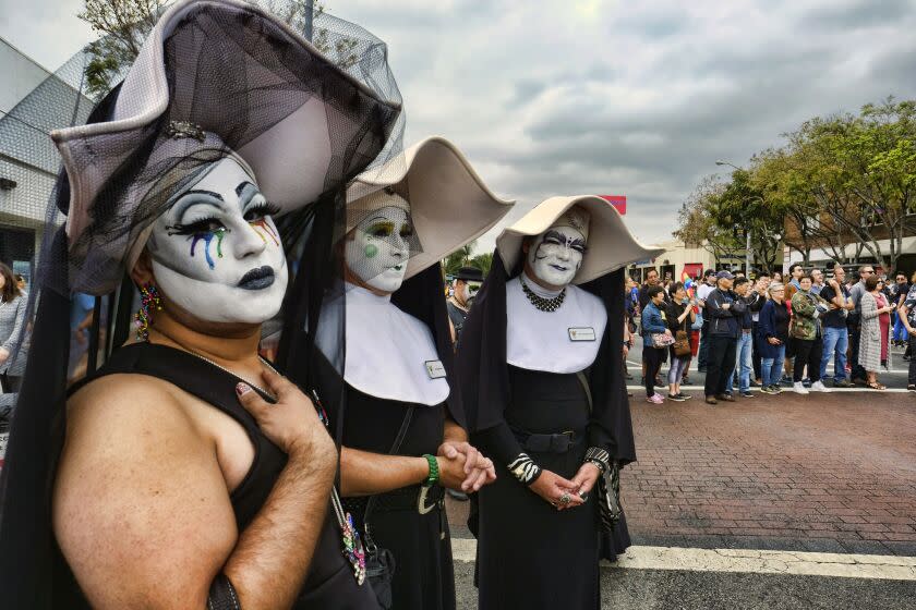 FILE - The Sisters of Perpetual Indulgence show their support during the gay pride parade in West Hollywood, Calif. on June 12, 2016. The Los Angeles Dodgers have removed a satirical LGBTQ+ group called the Sisters of Perpetual Indulgence from the team's annual Pride Night after opposition from conservative Catholic groups. The team announced Wednesday, May 17, 2023, that the group, which primarily consists of men dressed as nuns, wouldn't receive an award during the June 16 event, citing the "strong feelings" of people who were offended. (AP Photo/Richard Vogel, File)