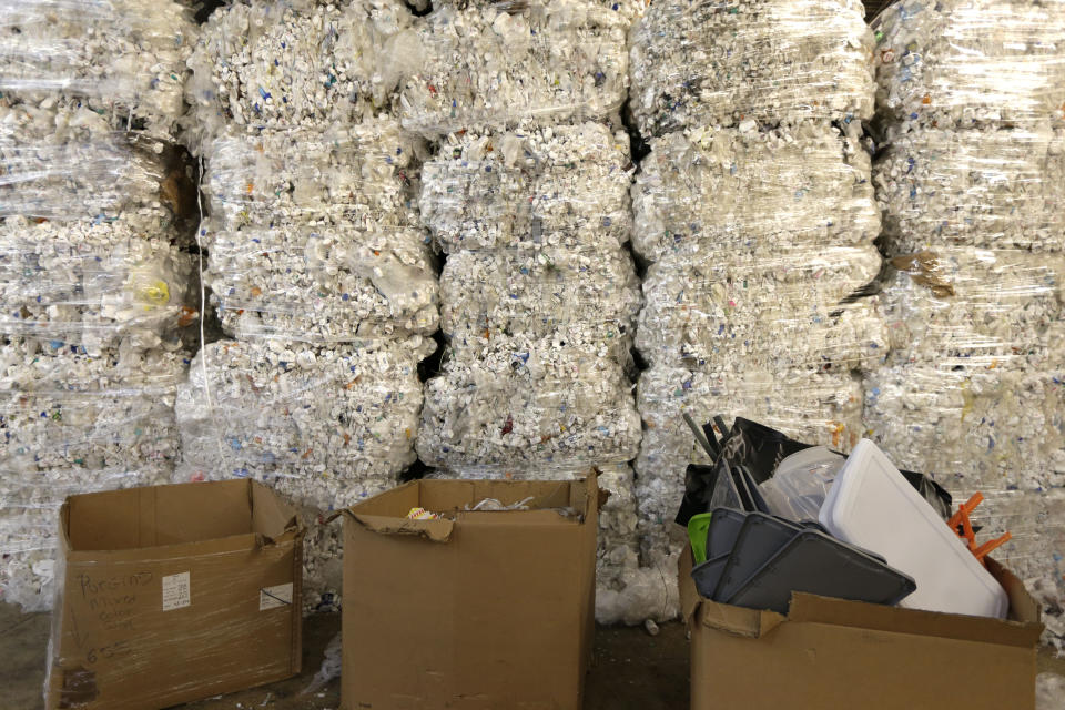 In this May 7, 2019 photo, plastic pill bottles are bundled for recycling at a GDB International warehouse in Monmouth Junction, N.J. According to GDB International president Sunil Bagaria, the domestic processing capacity of recyclable materials will need to increase as a growing number of countries restrict scrap imports. (AP Photo/Seth Wenig)