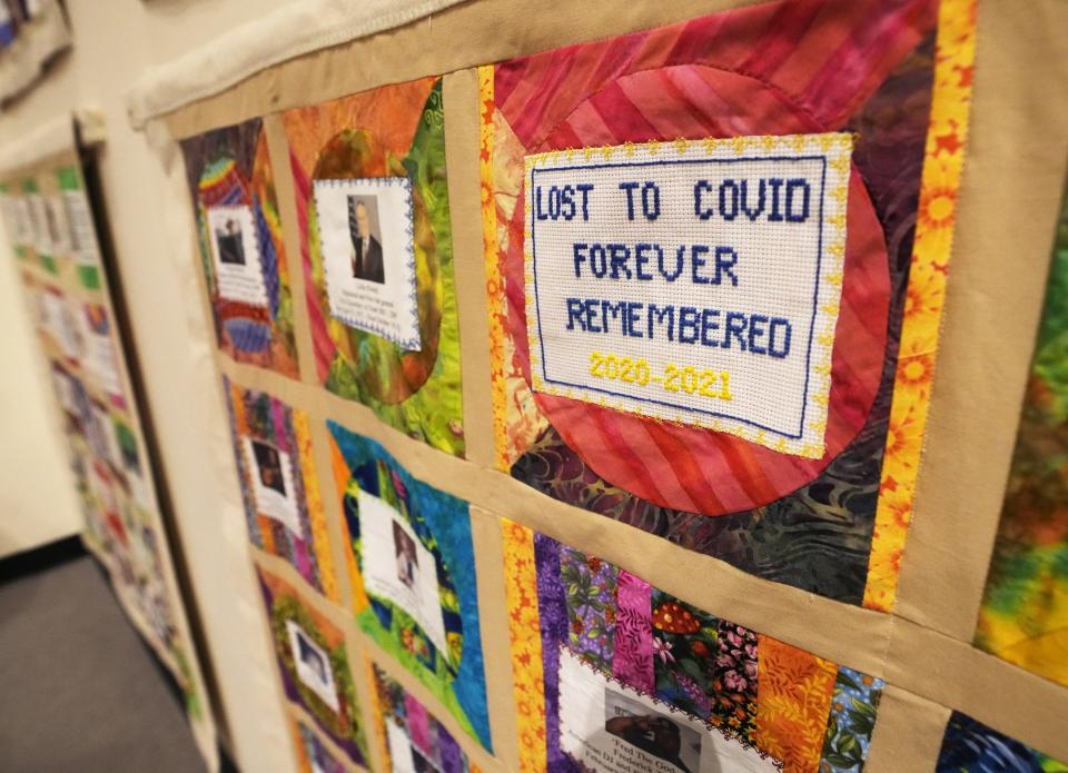 A COVID-19 memorial quilt is on display during an event at the Arizona Heritage Center on March 6, 2023.