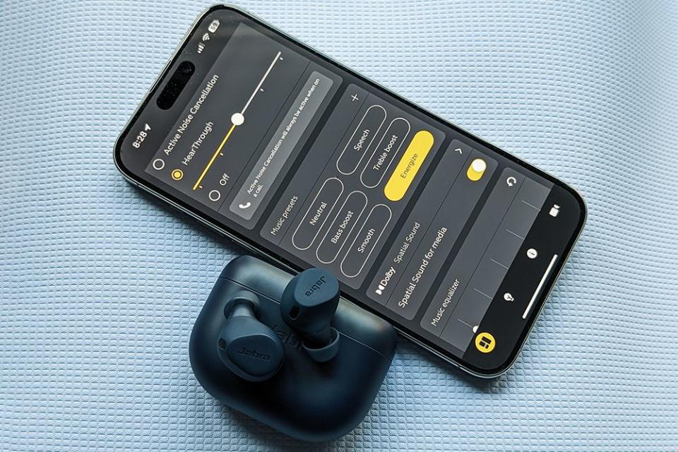 jabra 8 elite next to a phone showing the hear through settings in the app
