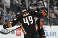 Anaheim Ducks defenseman Cam Fowler, right, celebrates with left wing Max Jones, after Fowler scored against the Winnipeg Jets during the first period of an NHL hockey game in Anaheim, Calif., Thursday, March 23, 2023. (AP Photo/Alex Gallardo)