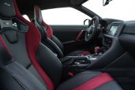 <p>Red accents on the exterior mirrors, steering wheel, and elsewhere are meant to declare sporty intent, but they might reflect the buyer's budget deficit as well.</p>