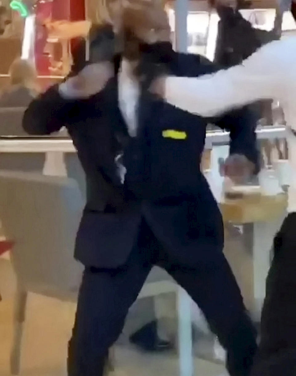 This is the shocking moment a security guard and a shopper viciously brawled outside a Selfridges following a row about entering the store with rollerblades. The smartly-dressed security worker traded punches with the irate customer after violence erupted at Birmingham's Bull Ring shopping centre on Saturday (26/9). The pair can be seen adopting boxing stances before exchanging blows in front of stunned shoppers at the entrance of the posh department store. In the footage, obtained by website Birmz Is Grime, one man can be heard saying "chill man" before the video ends with two burly men continuing to swing punches.