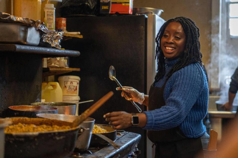 Fannie Gibson, owner of Fannie’s West African Cuisine on Troost Avenue near Hyde Park, prepares an order of peanut butter soup. The spices she adds are a secret.