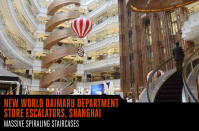 <p>The shape gets you on this one. Inside the New World Daimaru Department Store, a Shanghai shopping mall, 12 curved escalators fill the central atrium in the form of massive spiraling staircases. Mitsubishi built the project and raised the standard for out-there escalators.</p>