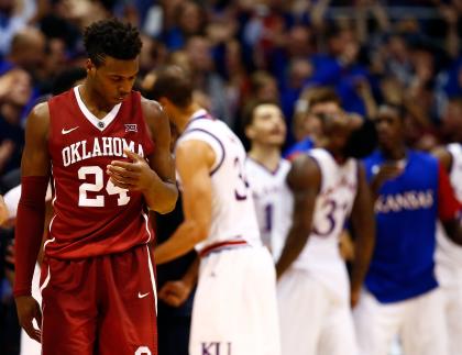 Buddy Hield reacts as Jayhawks celebrate during Oklahoma's loss. (Getty)