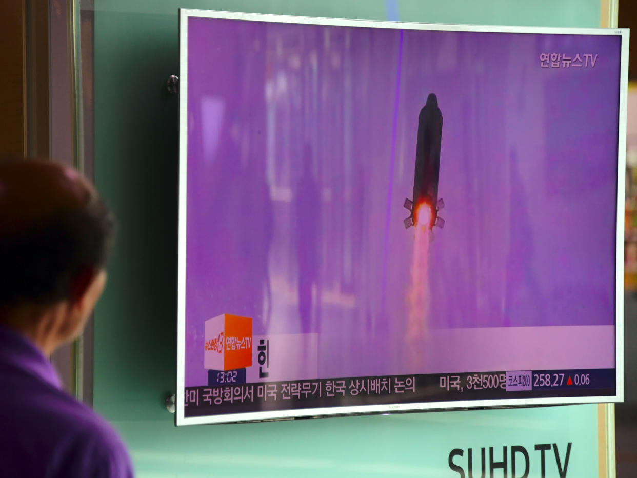 A man in Seoul watches file footage of a North Korea missile launch: Jung Yeon-Je/Getty