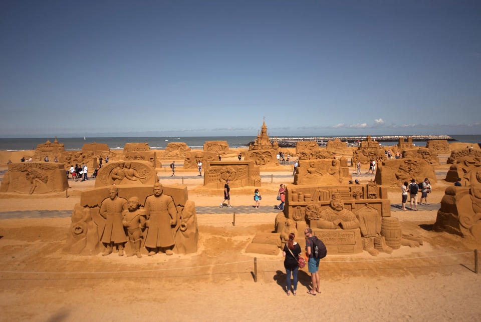 <p>Visitors at the Sand Sculpture Festival “Disney Sand Magic” in Ostend, Belgium. (Photo courtesy of Disneyland Paris) </p>