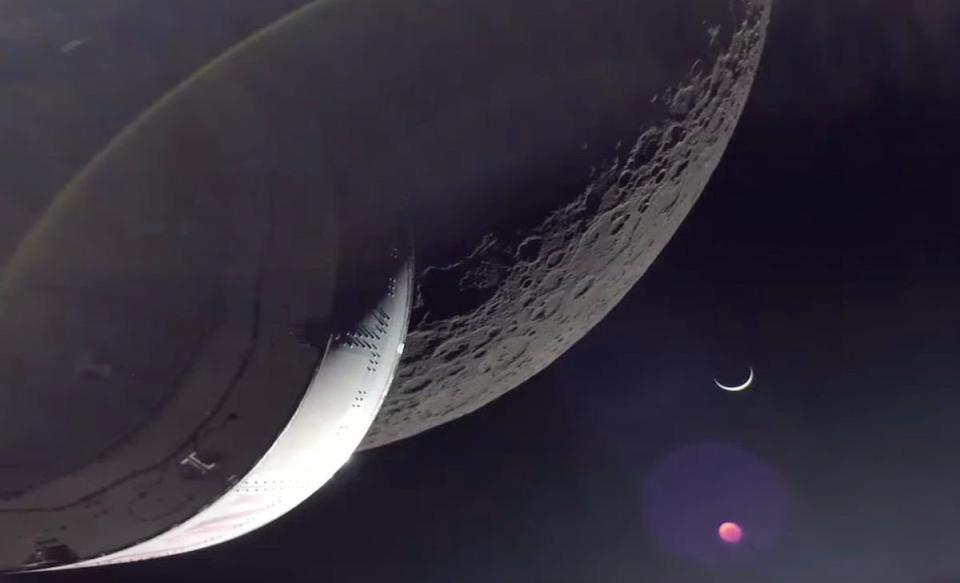 The Orion spacecraft captured this stunning view of a crescent Earth and the limb of the moon after completing the return powered flyby maneuver for the Artemis 1 mission.