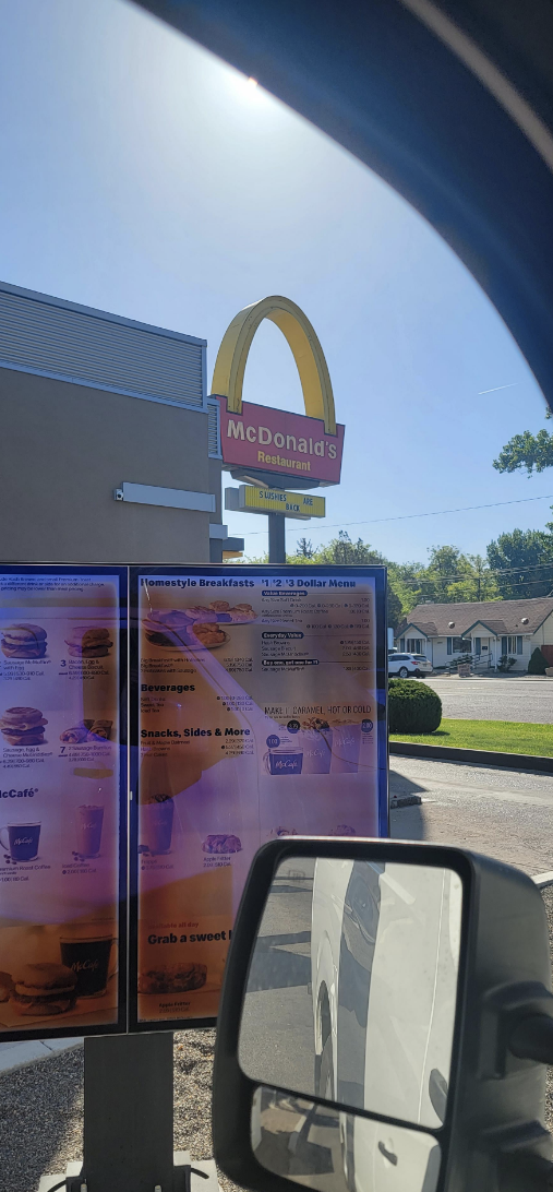 A McDonald's sign with one arch