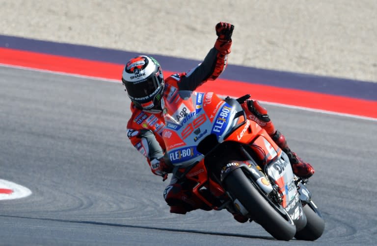 Ducati's Spanish rider Jorge Lorenzo celebrates his third pole position of the season at the San Marino MotoGP