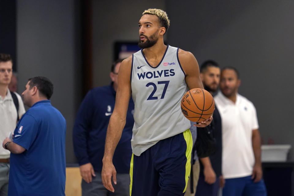 Minnesota Timberwolves center Rudy Gobert takes part in drills during the NBA basketball team's training camp, Tuesday, Sept. 27, 2022, in Minneapolis. (AP Photo/Abbie Parr)
