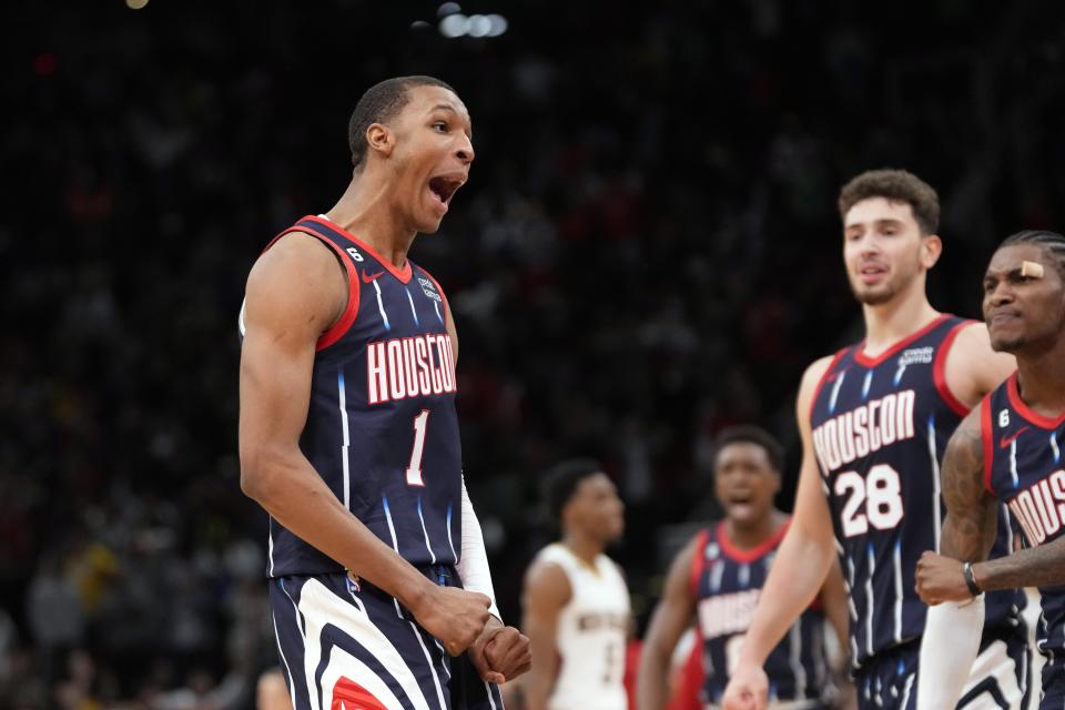 Houston Rockets' Jabari Smith Jr. (1) celebrates after making a game-winning basket against the New Orleans Pelicans during the second half of an NBA basketball game Friday, March 17, 2023, in Houston. The Rockets won 114-112. (AP Photo/David J. Phillip)