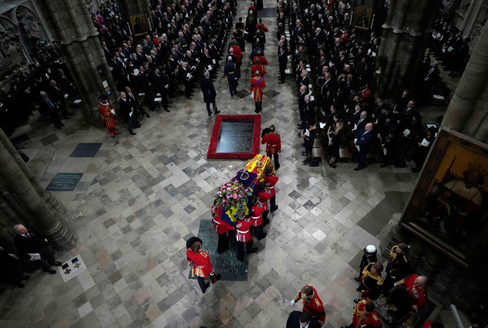 The coffin of Queen Elizabeth II with the imperial state crown resting on top is carried by the bearer party into Westminster Abbey during the State Funeral of Queen Elizabeth II.<span class="copyright">Frank Augstein—Pool/AFP/Getty Images</span>