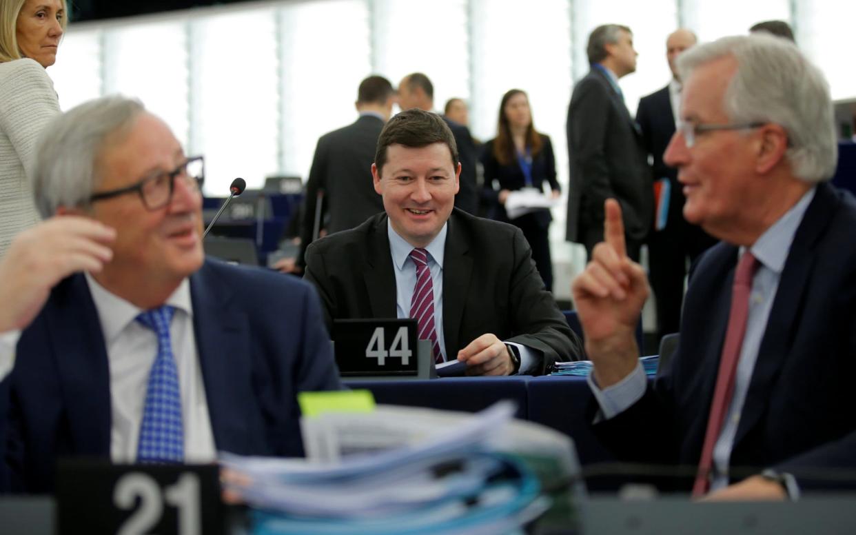 Martin Selmayr, the secretary general of the European Commission, is seen as the power behind Jean-Claude Juncker's (left) throne.  Michel Barnier, the EU's chief negotiator is on the right. - REUTERS