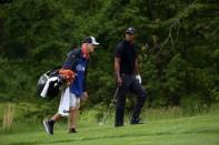 May 17, 2019; Bethpage, NY, USA; Tiger Woods and his caddie Joe LaCava on the fourth hole during the second round of the PGA Championship golf tournament at Bethpage State Park - Black Course. Mandatory Credit: Peter Casey-USA TODAY Sports