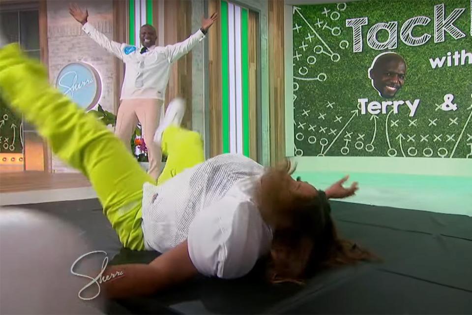 Sherri Shepherd tackles a dummy with Terry Crews on 'Sherri'