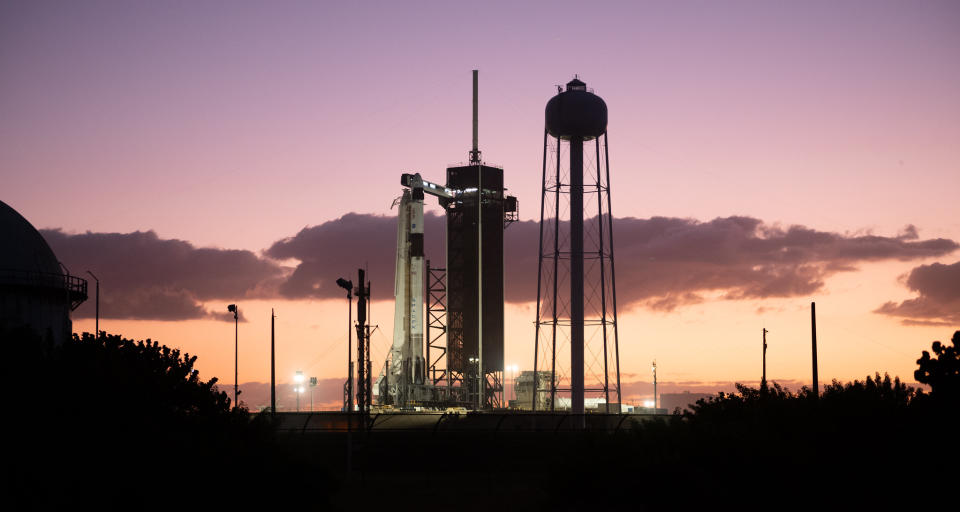 A SpaceX Falcon 9 rocket with the company's Crew Dragon spacecraft onboard is seen at sunset on the launch pad at Launch Complex 39A as preparations continue for the Crew-3 mission, Tuesday, Nov. 9, 2021, at NASA’s Kennedy Space Center in Florida.