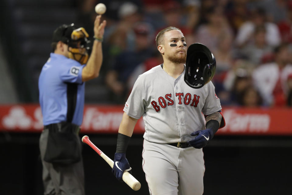 Boston Red Sox's Christian Vazquez tosses his hemet after striking out against the Los Angeles Angels during the second inning of a baseball game in Anaheim, Calif., Saturday, Aug. 31, 2019. (AP Photo/Chris Carlson)