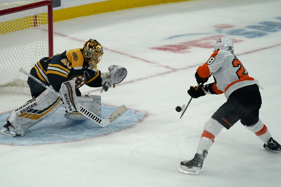 Boston Bruins goaltender Tuukka Rask (40) makes the save on this attempt by Philadelphia Flyers center Claude Giroux (28) during a shootout in an NHL hockey game, Thursday, Jan. 21, 2021, in Boston. The Bruins won 5-4 in a shootout. (AP Photo/Elise Amendola)