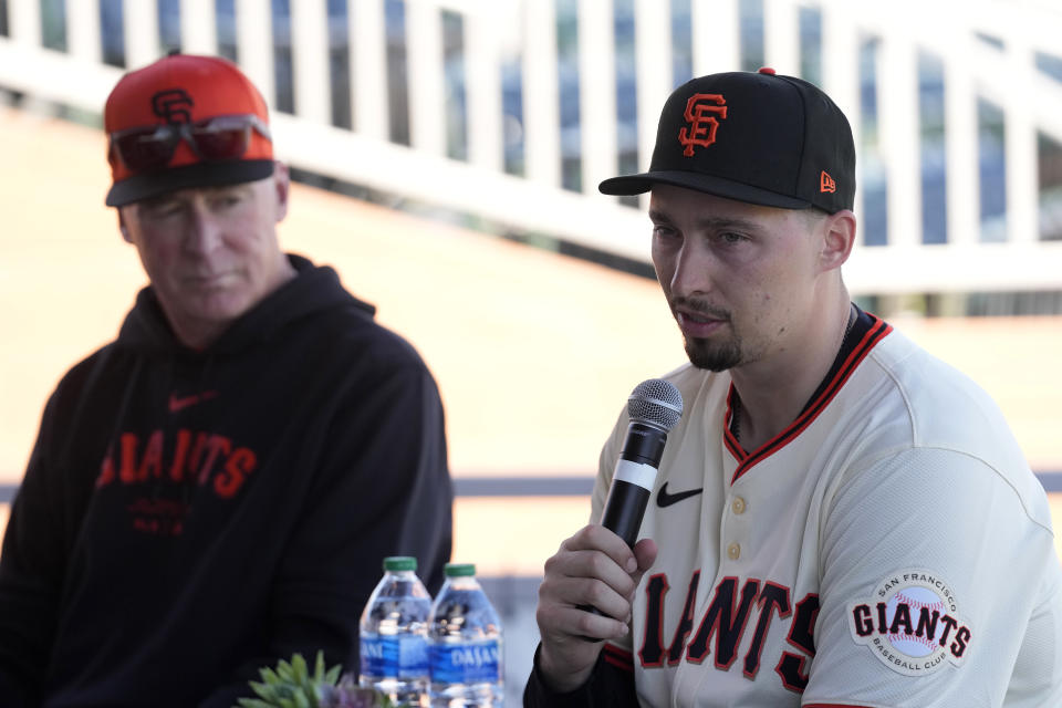 New San Francisco Giants pitcher Blake Snell, right, speaks as he is introduced during a baseball news conference as Giants manager Bob Melvin, left, looks on, Wednesday, March 20, 2024, in Scottsdale, Ariz. (AP Photo/Ross D. Franklin)
