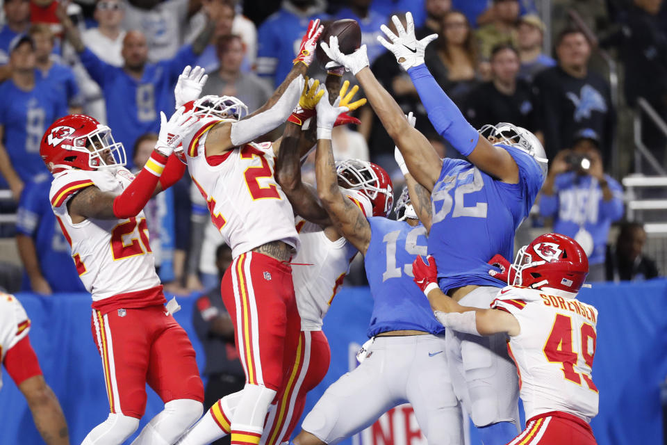 Kansas City Chiefs free safety Juan Thornhill (22), strong safety Jordan Lucas (24), and defensive back Bashaud Breeland (21), break up the pass intended for Detroit Lions wide receiver Kenny Golladay (19), and tight end Logan Thomas (82) with time expiring during the second half of an NFL football game, Sunday, Sept. 29, 2019, in Detroit. (AP Photo/Rick Osentoski)