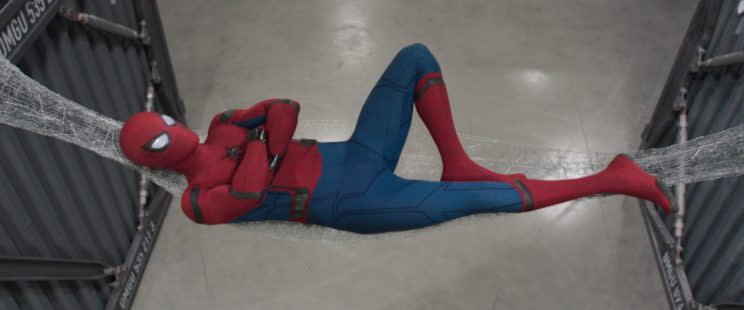 Spider-Man (Tom Holland) takes a rest while thinking in 