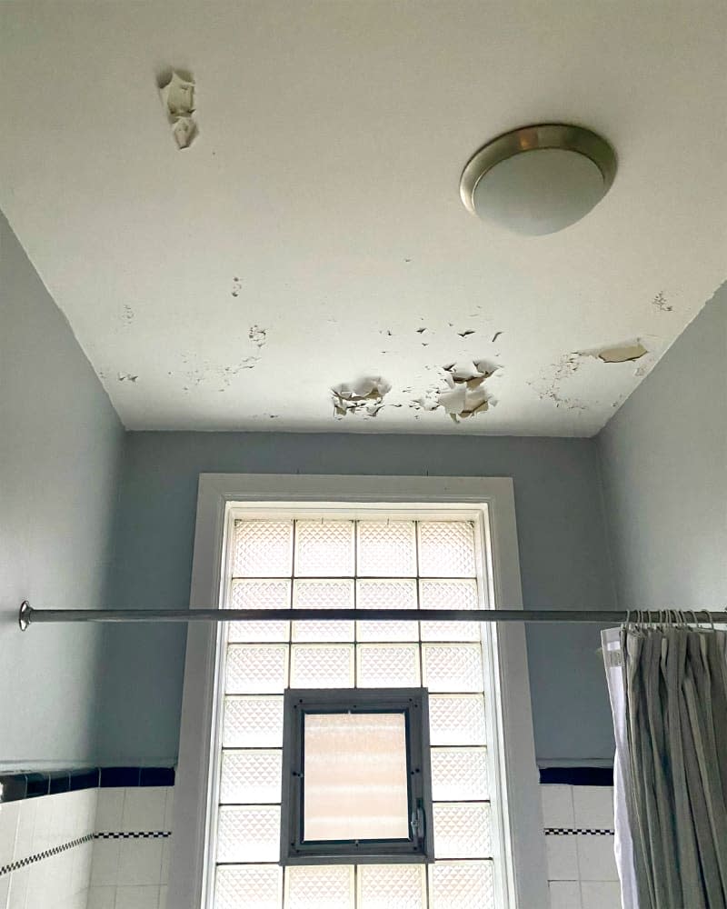 Ceiling flaking before renovation.