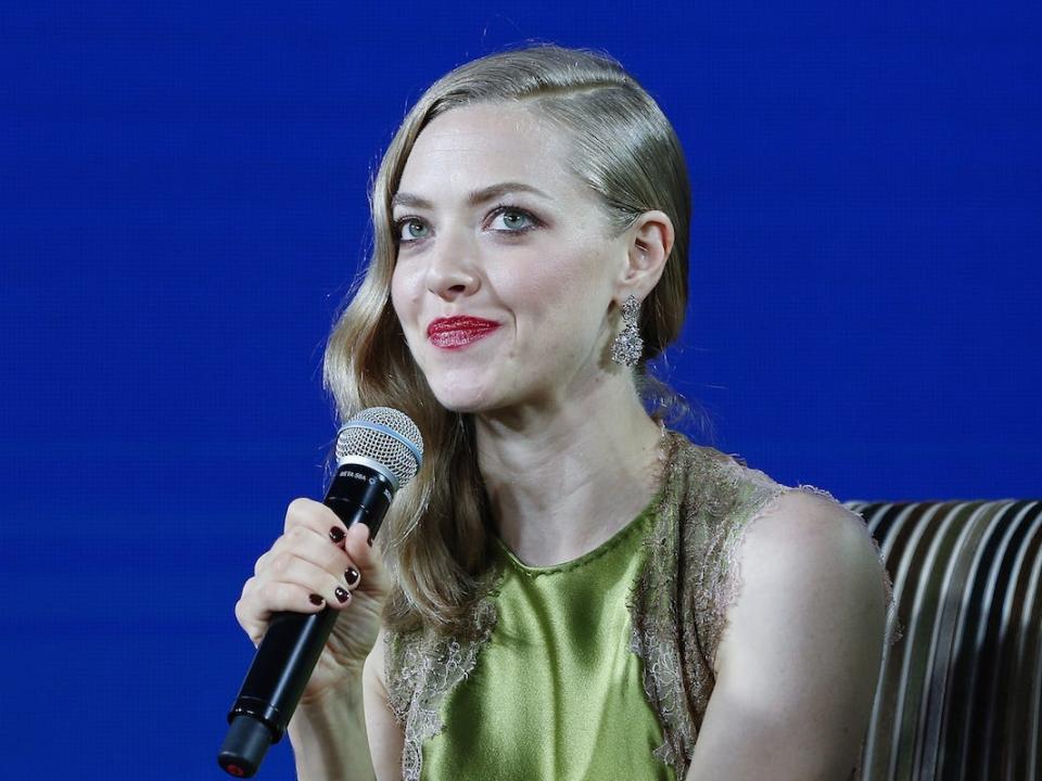 Amanda Seyfried speaks into a microphone