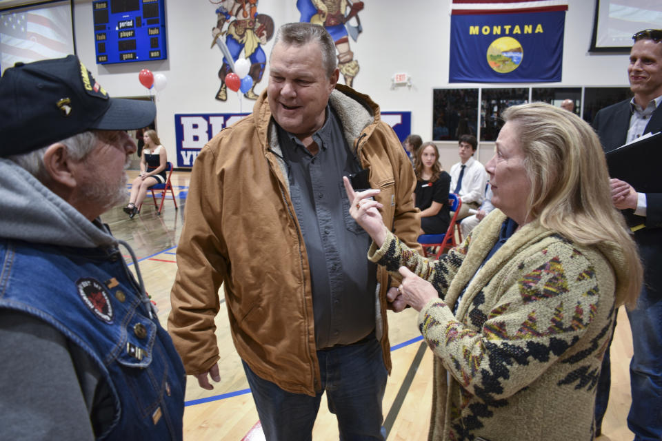 Sen. Jon Tester, D-Mont., speaks with attendees at a Veterans Day event at Bigfork High School, on Nov. 10, 2023, in Bigfork, Mont. As he seeks reelection to a fourth term the Montana Democrat is expected to face a stiff challenge from Republicans eager to capture the Senate majority. (AP Photo/Matthew Brown)