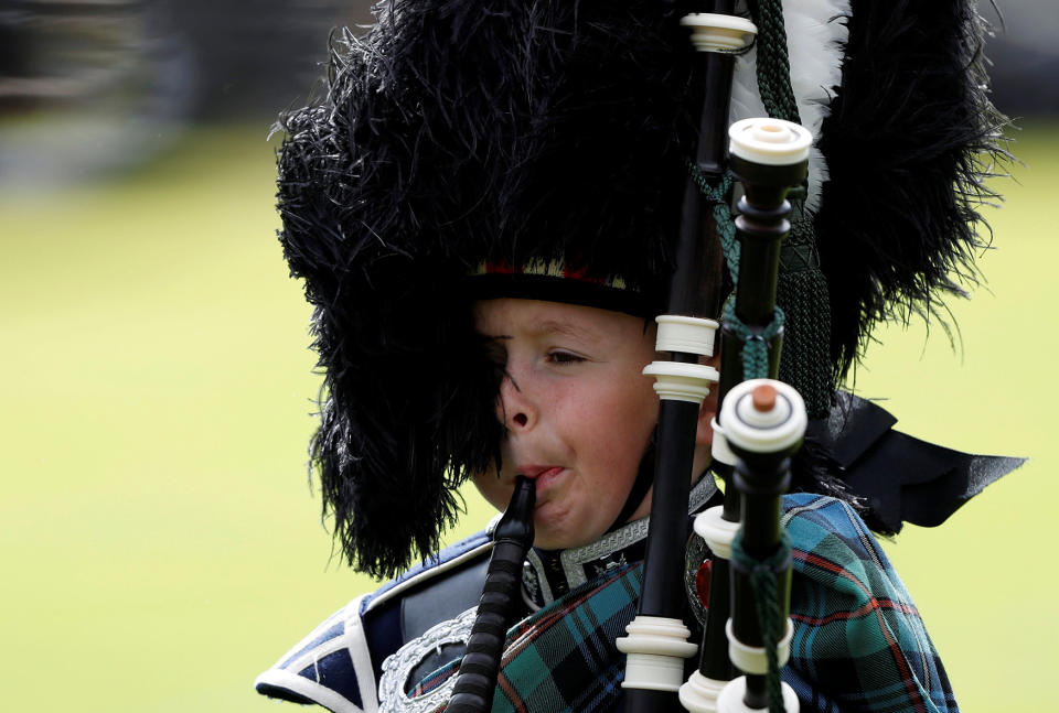 A young piper plays at the annual Braemar Highland Gathering in Scotland