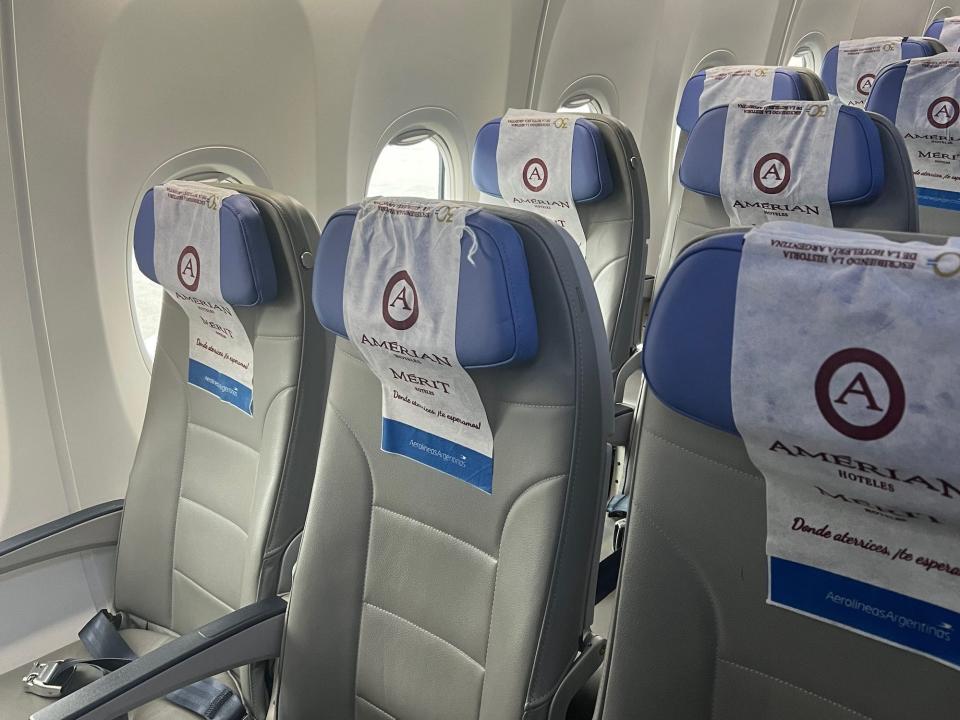 Inside Aerolineas Argentinas Boeing 737 with blue headrests.