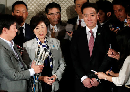 Tokyo Governor Yuriko Koike (2nd L), who is also head of Party of Hope, and Democratic Party leader Seiji Maehara (2nd R) attend a news conference after their talks in Tokyo, Japan, October 5, 2017. REUTERS/Issei Kato