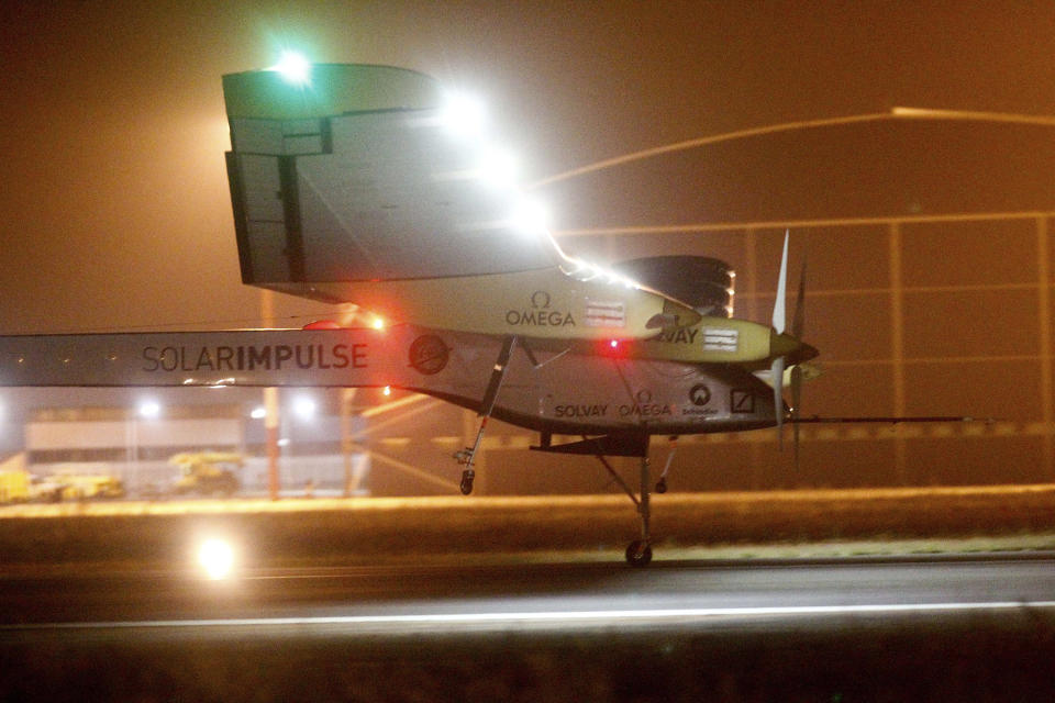 An experimental solar-powered plane, Solar Impulse, approaches to make a night landing at Rabat airport, Morocco, Tuesday, June 5, 2012 after a 20-hour trip from Madrid in the first transcontinental flight by a craft of its type. (AP Photo/Abdeljalil Bounhar)