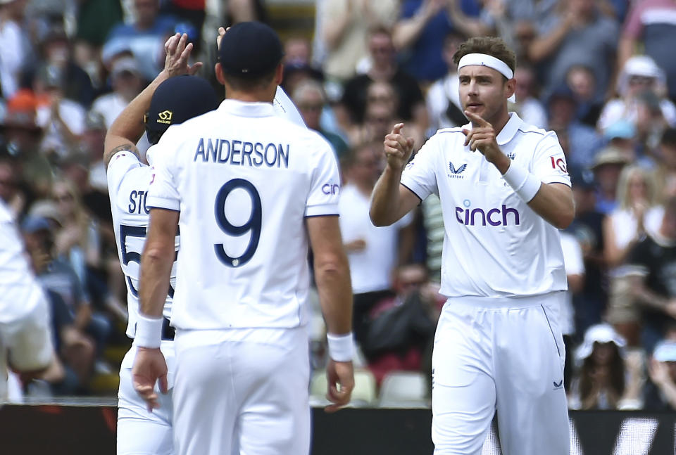 England's Stuart Broad, right, celebrates after taking the wicket of Australia's Scott Boland during day five of the first Ashes Test cricket match, at Edgbaston, Birmingham, England, Tuesday, June 20 2023. (AP Photo/Rui Vieira)