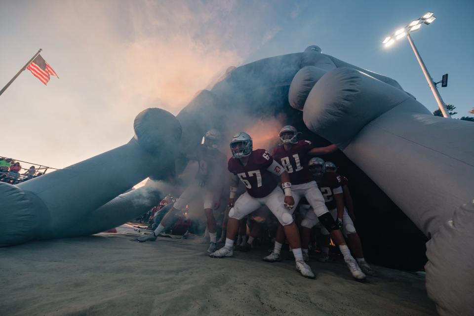 Dover's football team gets amped up before the game against Steubenville Friday, September 17 at Crater Stadium. Friday night will be the last time the Crimson Tornadoes play at The Brickhouse this season.