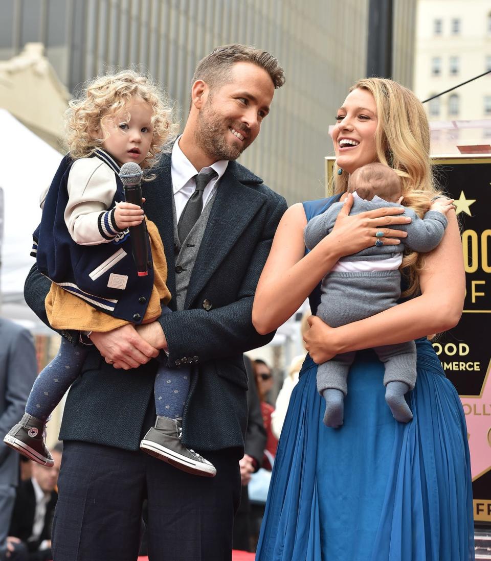 ryan reynolds holding their daughter james and blake lively holding their daughter inez in 2016