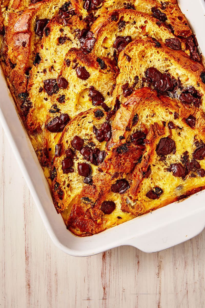 <p>Bread and butter pudding is a quintessentially British dessert. Our version has had a little upgrade for Christmas, swapping bread for panettone and studding the bake with cubes of milk chocolate.</p><p>Get the <a href="http://www.delish.com/uk/cooking/recipes/a29781634/bread-and-butter-pudding-christmas/" rel="nofollow noopener" target="_blank" data-ylk="slk:Panettone Bread and Butter Pudding;elm:context_link;itc:0;sec:content-canvas" class="link ">Panettone Bread and Butter Pudding</a> recipe.</p>