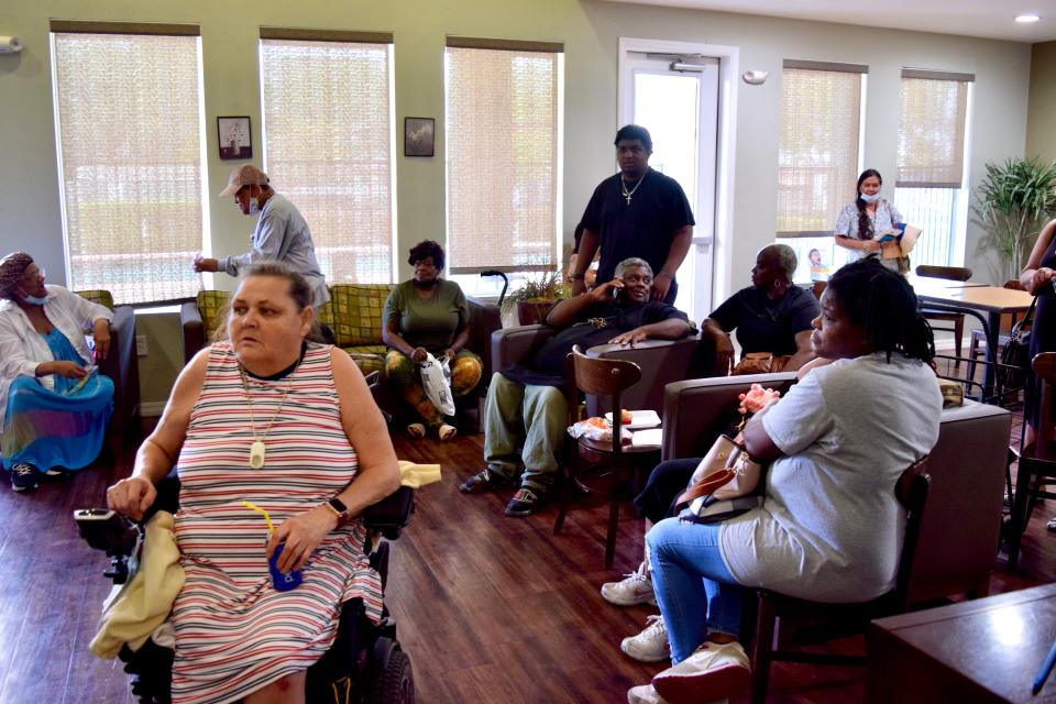 Residents of Grandfamilies Place wait in the Grandfamilies Place clubhouse to receive rental and utility assistance from the City of Phoenix Human Services Department on July 21, 2022.