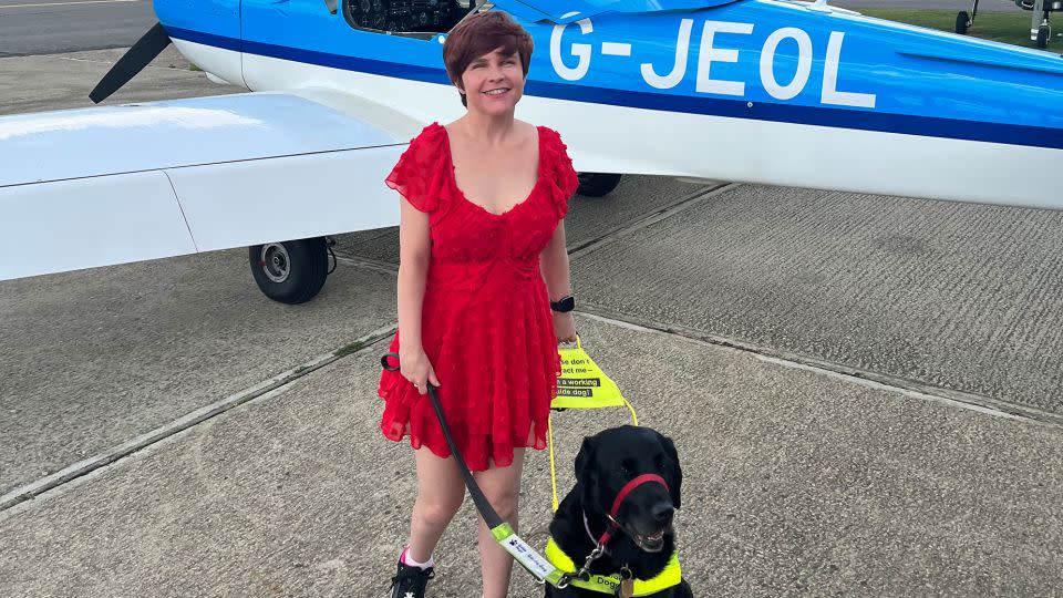 Here's Wyatt and her guide dog, Ida, about to board a small airplane for a flying lesson. - Sassy Wyatt