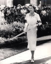 The Queen embraced Christian Dior’s post-war ‘New Look’ shape for women in the ‘50s. She kept cool during her Australian tour in 1954 wearing a white lace dress with a matching parasol.