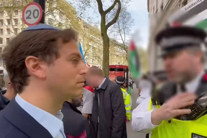 A screengrab from the video posted by Campaign Against Antisemitism of their chief executive Gideon Falter speaking to a Metropolitan Police during a pro-Palestine march in London. Mr Falter, was wearing a kippah skull cap when he was stopped from crossing the road near the demonstration in Aldwych