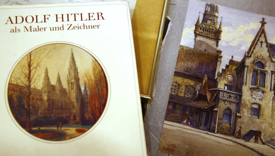 Watercolour by Hitler lies next to catalog of his paintings at auction house in Nuremberg