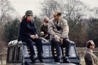 <p>Prince Philip and his daughter, Princess Anne, sit on the hood of their Land Rover as they enjoy a day out together in 1980. </p>