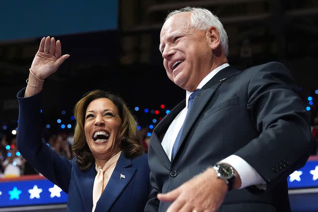 <p>Andrew Harnik/Getty</p> Kamala Harris and Tim Walz at a campaign event