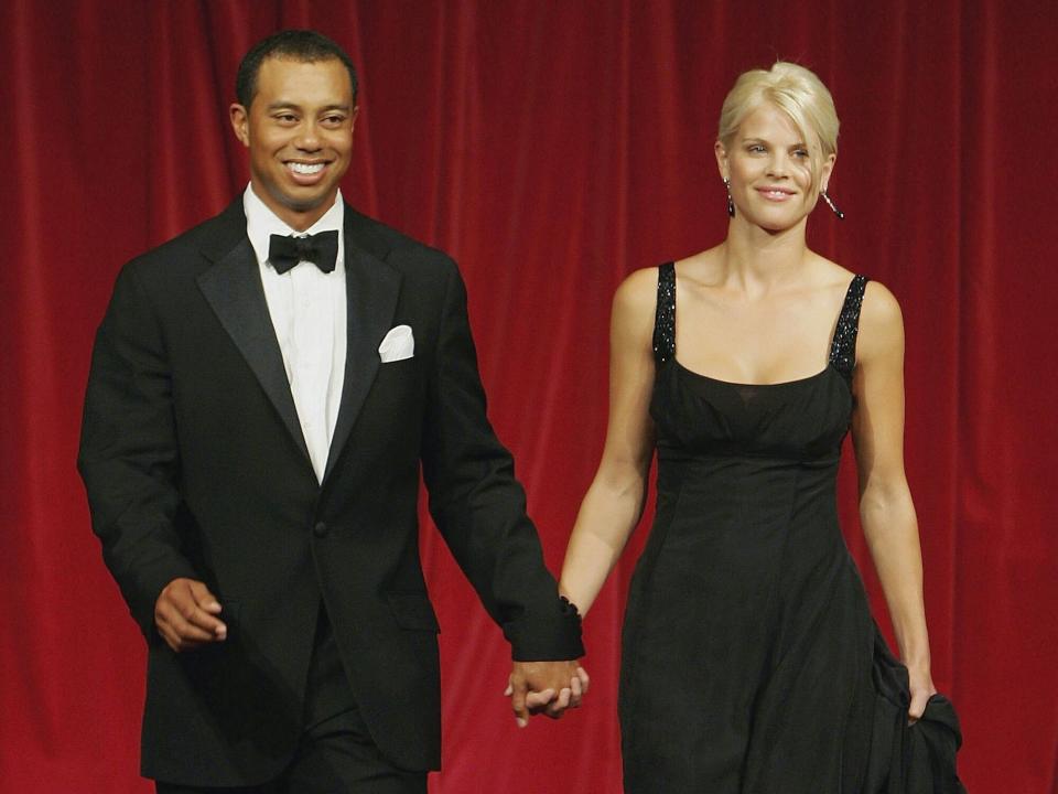 Tiger Woods and his wife Elin walk down the catwalk during the Ryder Cup Gala Dinner at Citywest Hotel and Golf Resort September 20, 2006 in Dublin, Ireland