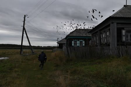 The Wider Image: Russian village's last teacher stays on for her one remaining pupil