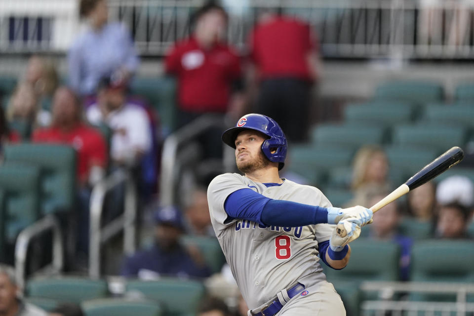 Chicago Cubs' Ian Happ (8) hits a home run in the third inning of a baseball game against the Atlanta Braves, Tuesday, April 26, 2022, in Atlanta. (AP Photo/Brynn Anderson)